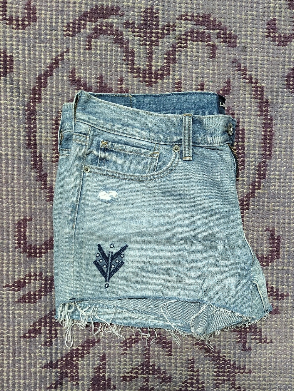 Light Wash Denim Cut Off Jean Shorts with Embroidered Detail